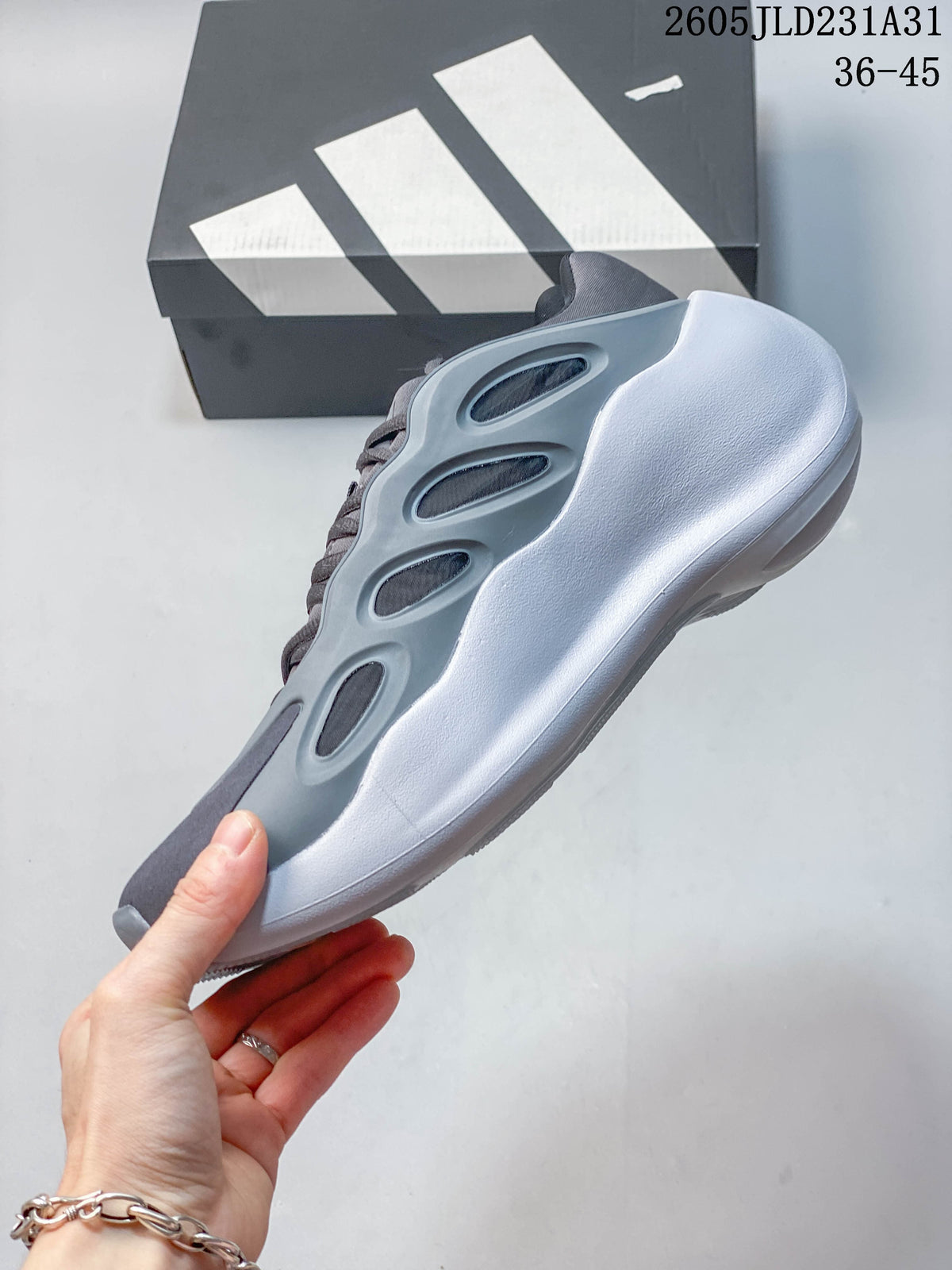 Side profile of a grey Adidas Hyperboost sneaker with open-frame side detailing and a thick white sole.
