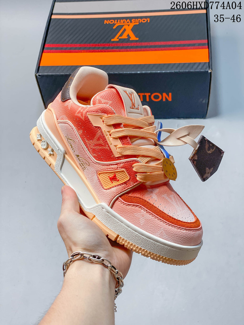 White, yellow, and burgundy low-top sneaker with a bold side motif