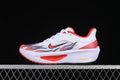 Side view of white Nike Zoom Fly 6 running shoe with red accents and flame-inspired graphics