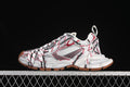 Side view of white Balenciaga 3XL sneakers with red and gray accents, logo-patterned laces, and brown-toned outsoles