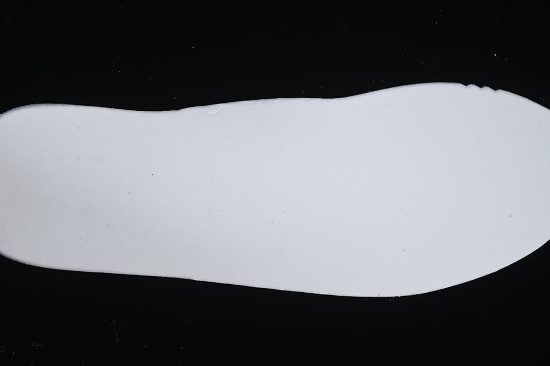 White shoe outsole shown against a black background