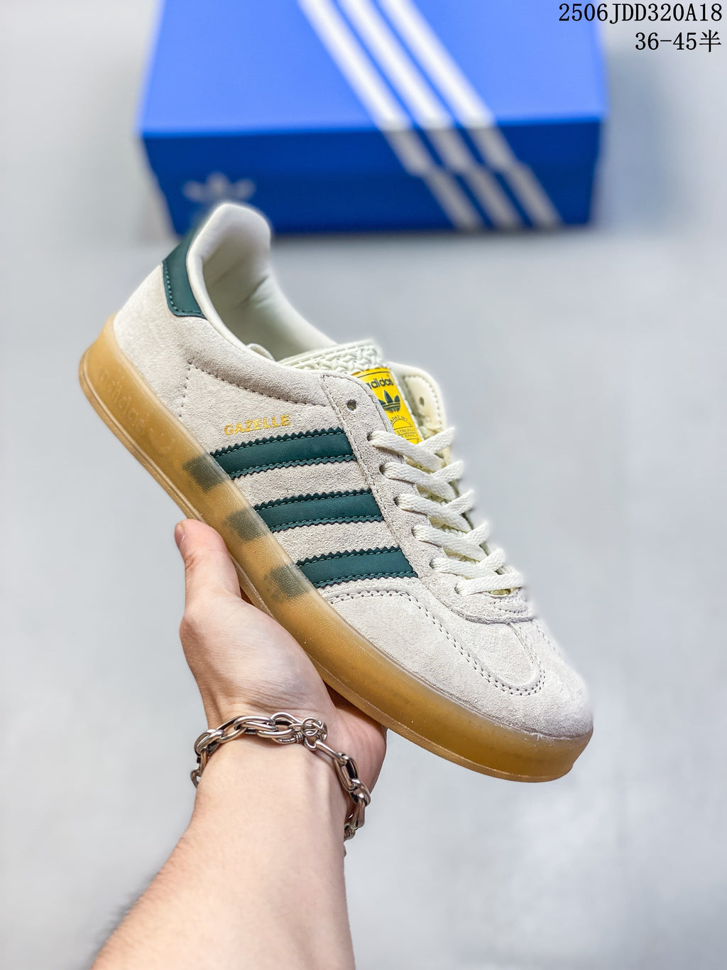Cream Adidas Gazelle 90 sneaker with dark teal stripes and a gum-style sole