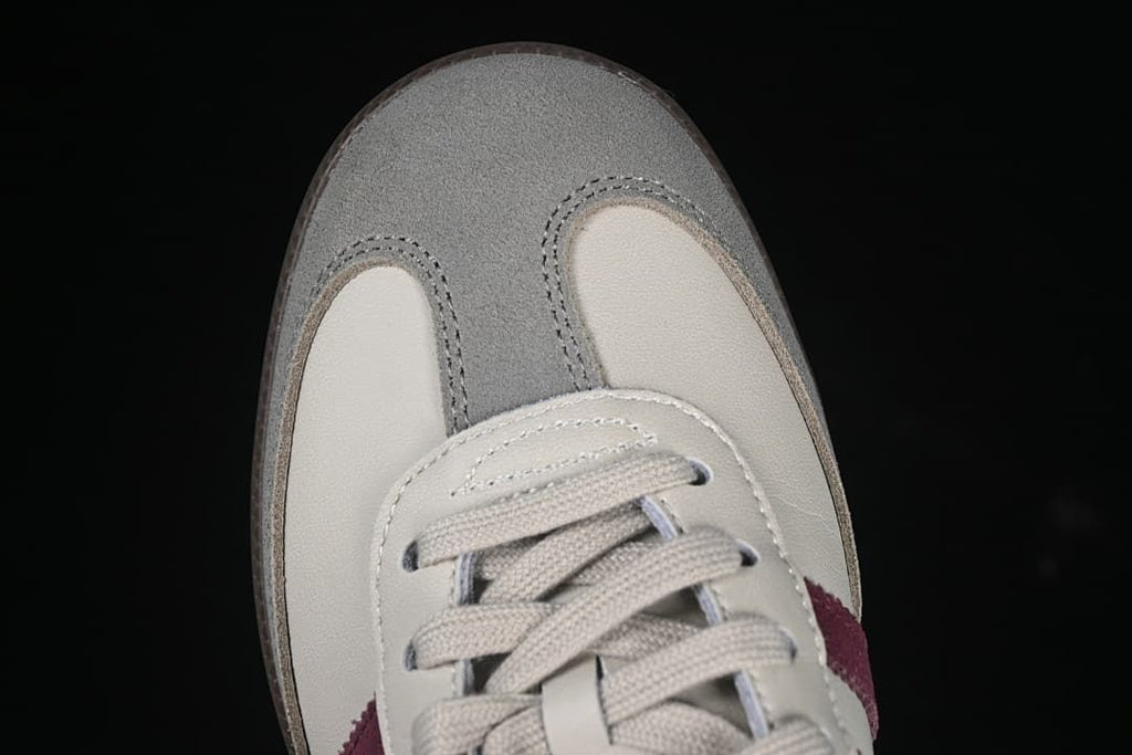 Top-down close-up of the gray toe overlay and cream toe panels.