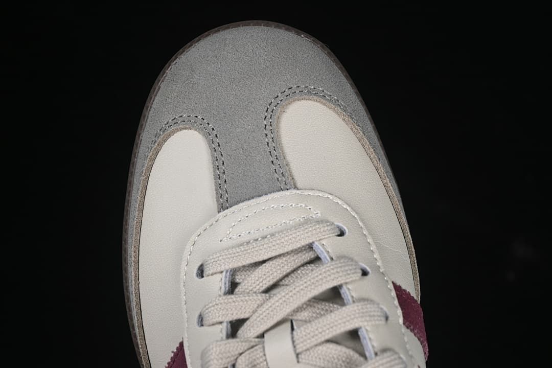 Top-down close-up of the gray toe overlay and cream toe panels.