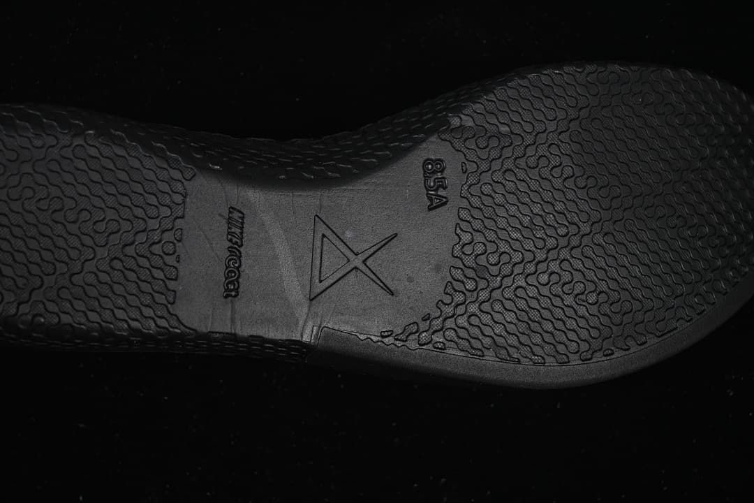Close-up of textured black outsole with Kobe-style emblem