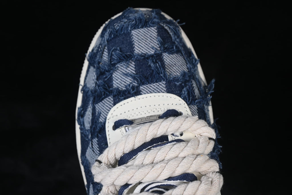 Top-down close-up of the denim-style toe and thick rope laces