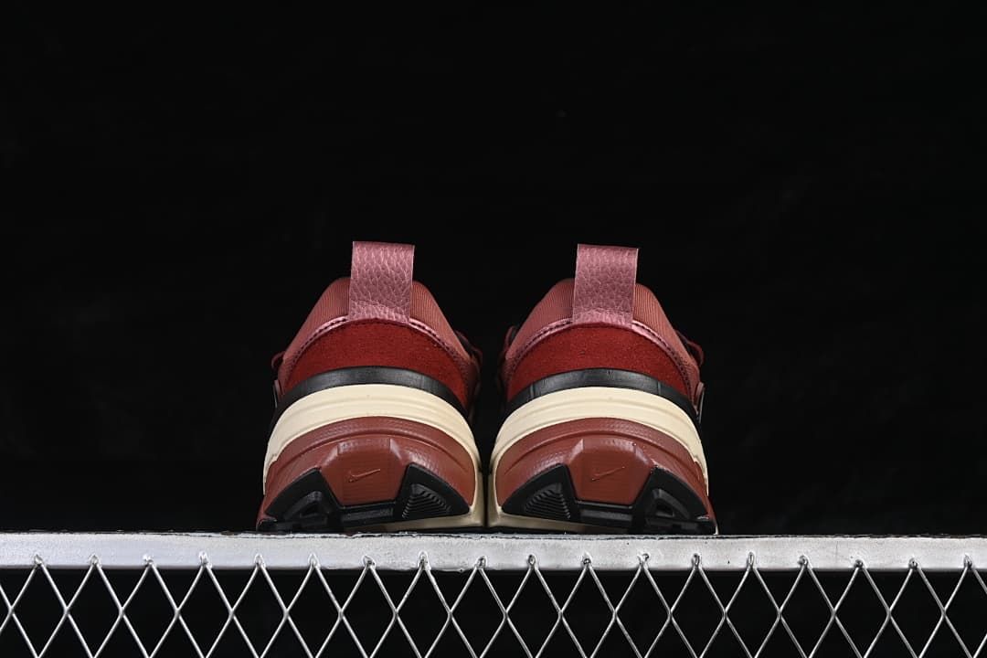 Rear view of both shoes showing heel pull tabs and outsoles