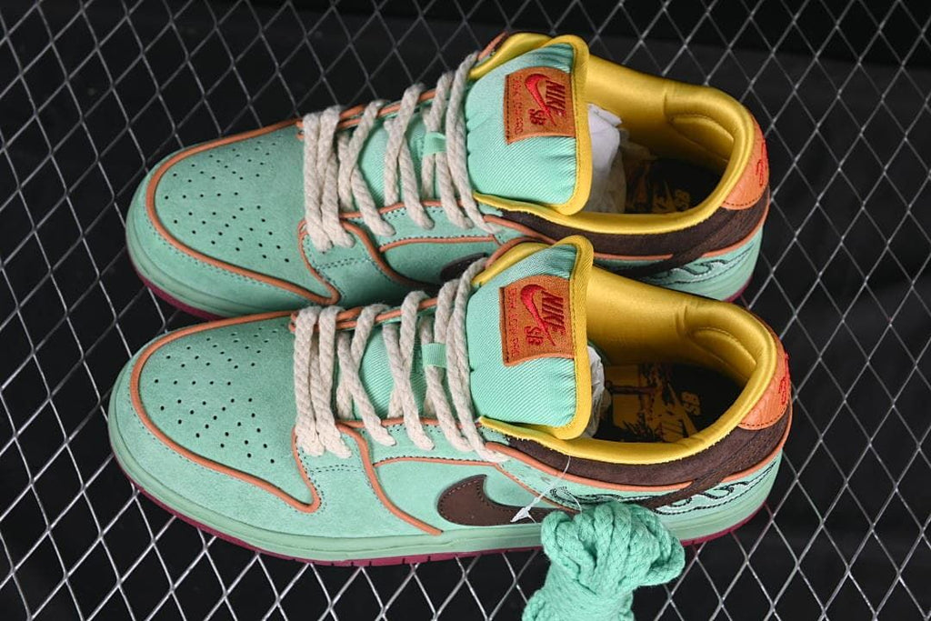 Pair of multicolor Nike SB Dunk Low sneakers shown from above.