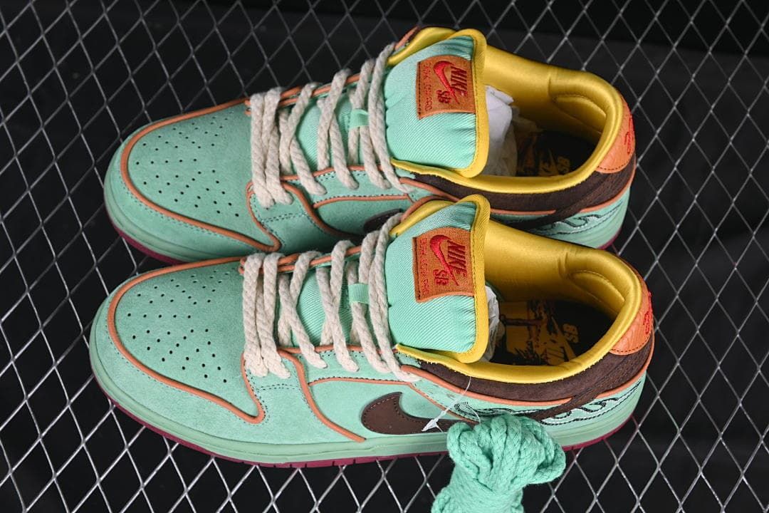 Pair of multicolor Nike SB Dunk Low sneakers shown from above.