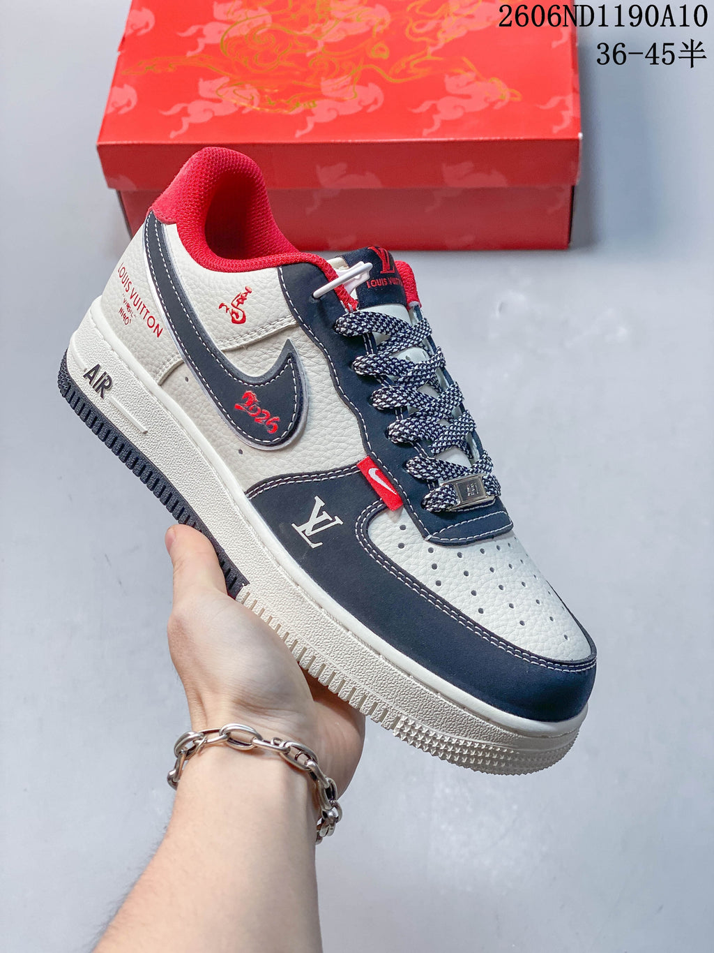 Angled side view showing decorative graphics, navy overlays, and red details