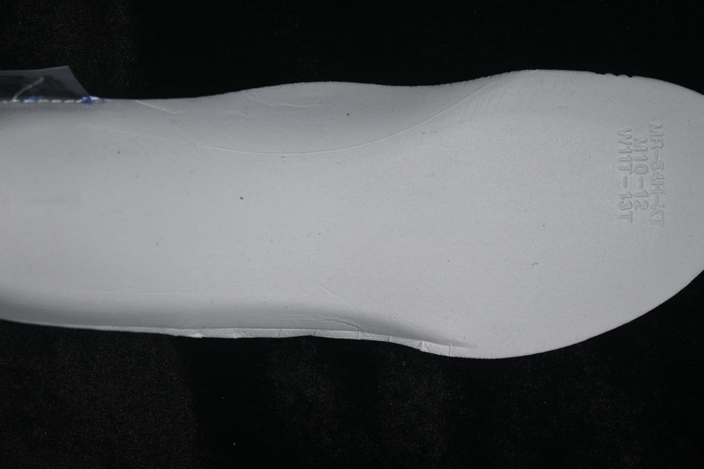 White shoe insert with embossed size-range markings.