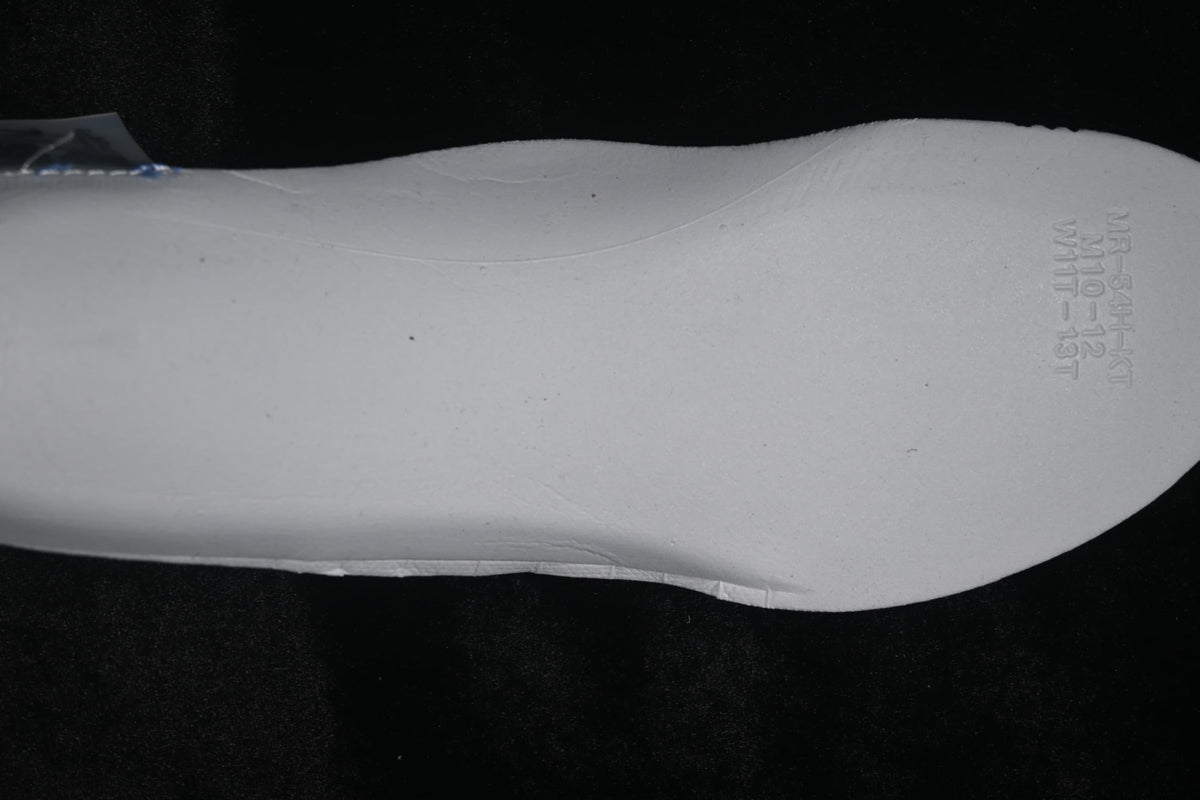 White shoe insert with embossed size-range markings.