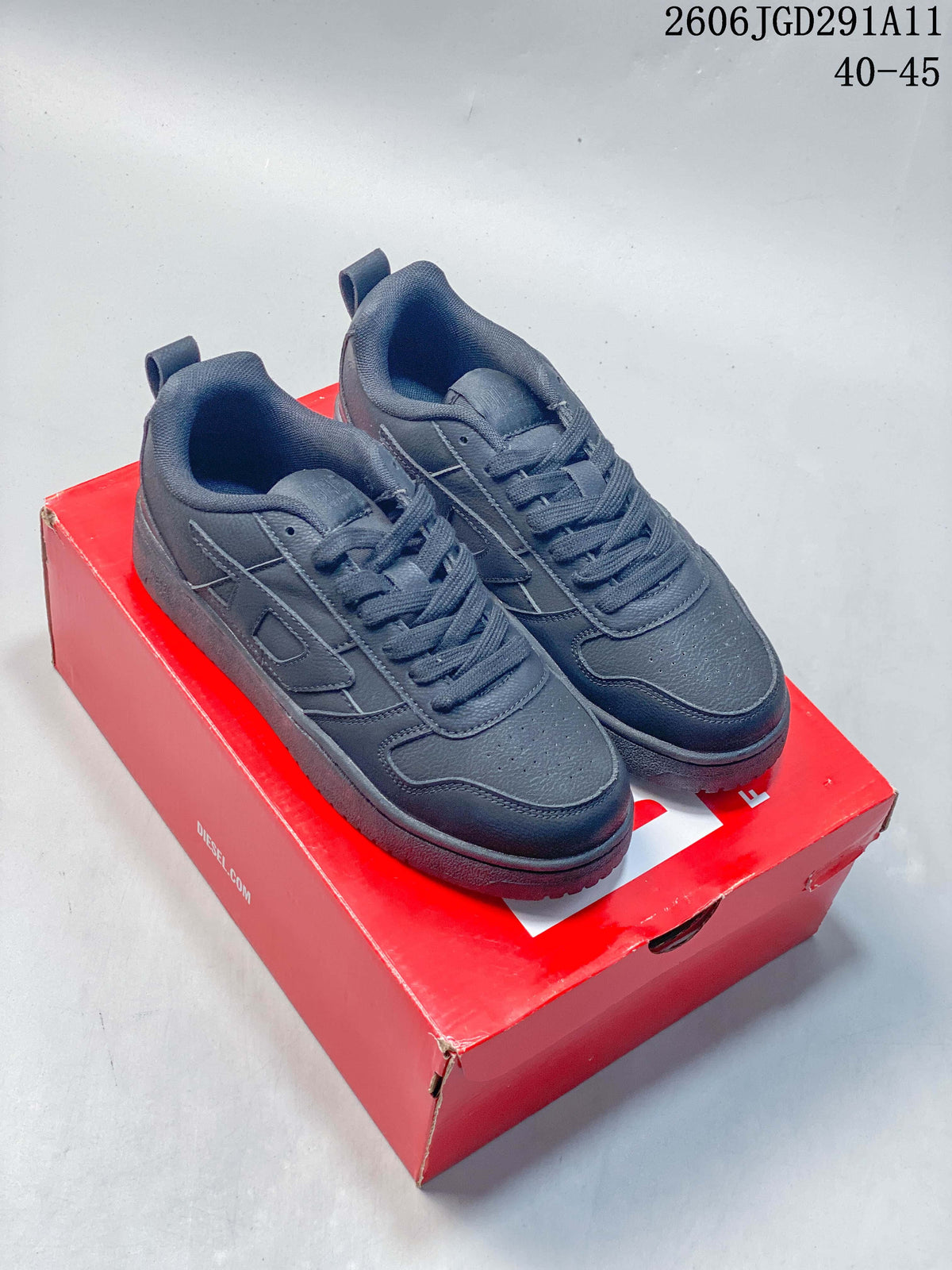 Pair of dark gray Diesel S-UKIYO V2 low-top sneakers displayed on a red shoe box