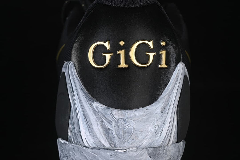 Rear view showing gold GiGi lettering and marbled heel detail