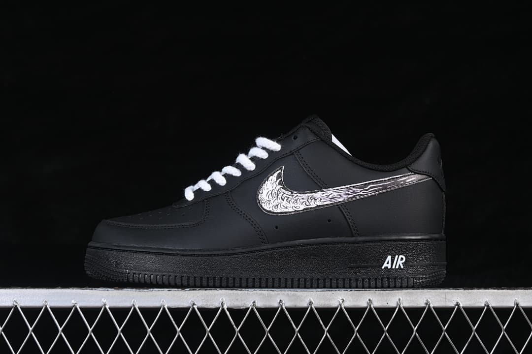 Side view of a black low-top sneaker with white laces and an illustrated Swoosh graphic