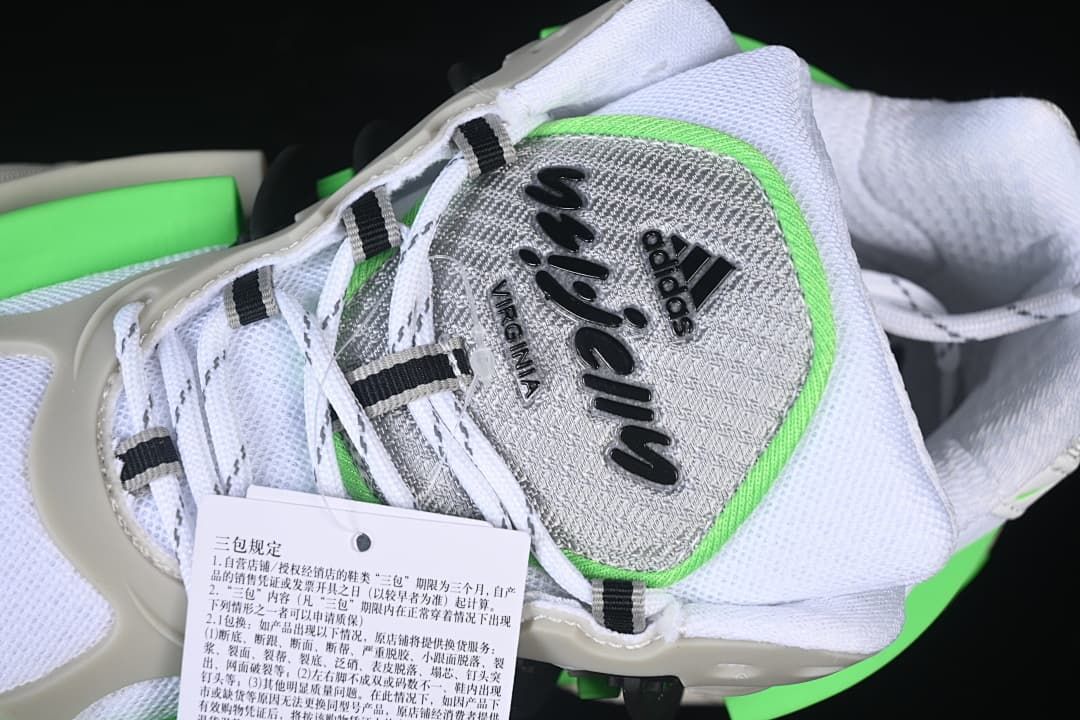 Top detail of the tongue branding, laces, and attached product tag.