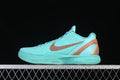 Side view of turquoise Nike Kobe VI Protro basketball shoe with copper-toned accents.