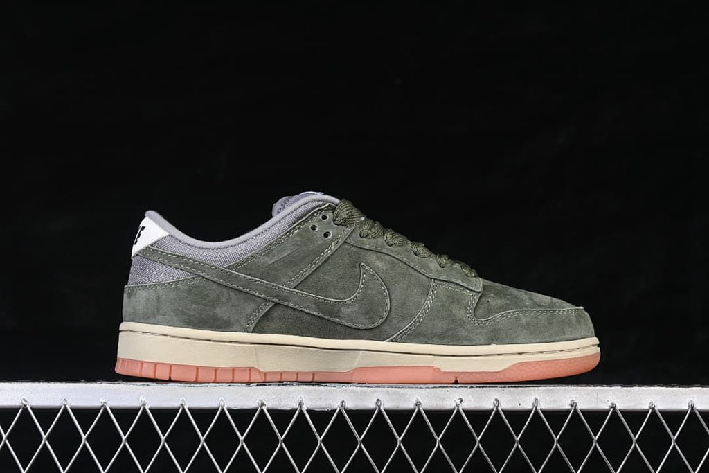 Side profile of the low-top sneaker with olive-green upper and contrasting sole