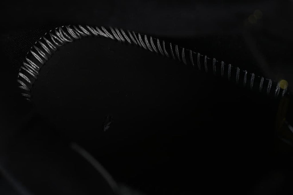 Close-up of stitching and detailing on the shoe upper