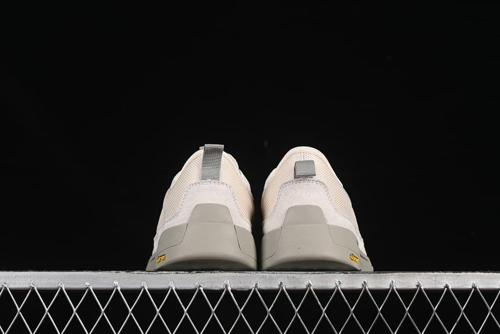 Rear view of both sneakers showing heel details