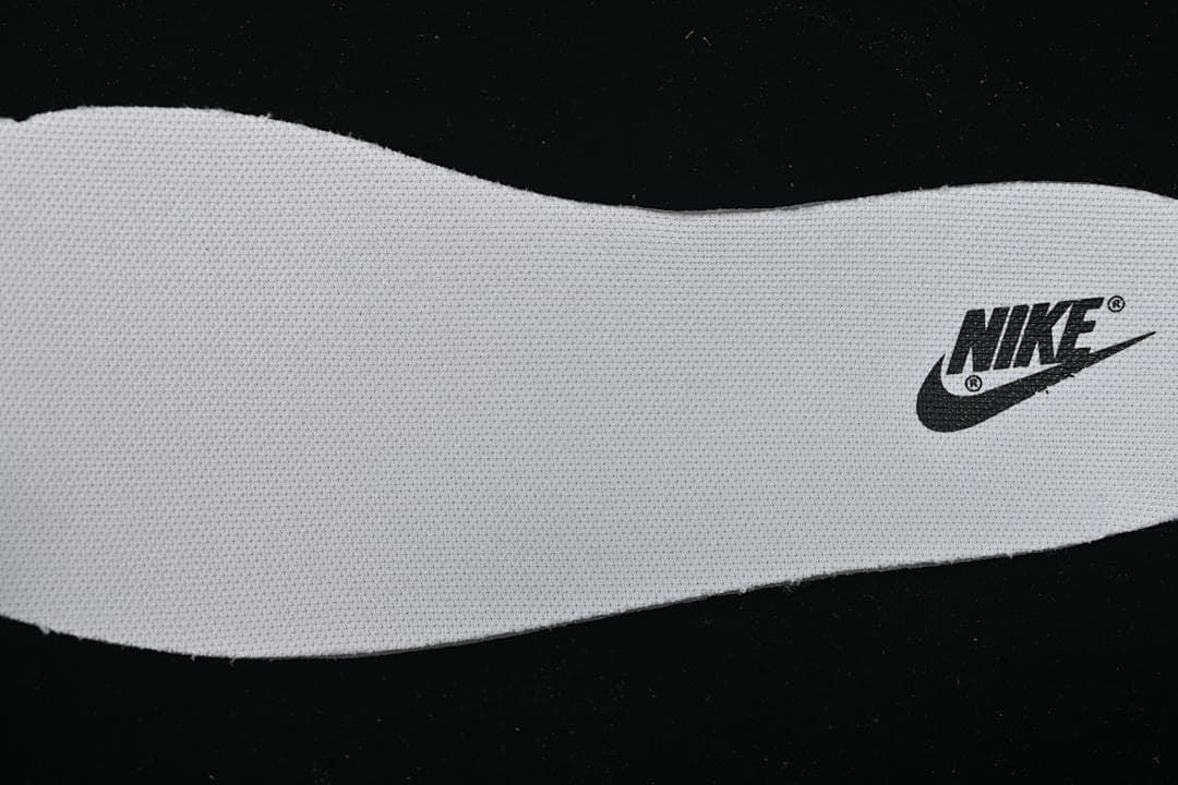 Close-up of a white shoe insole with Nike logo