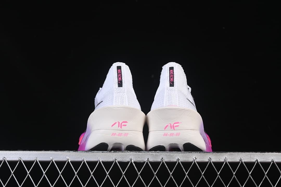Rear view of both shoes showing heel details and pink accents.