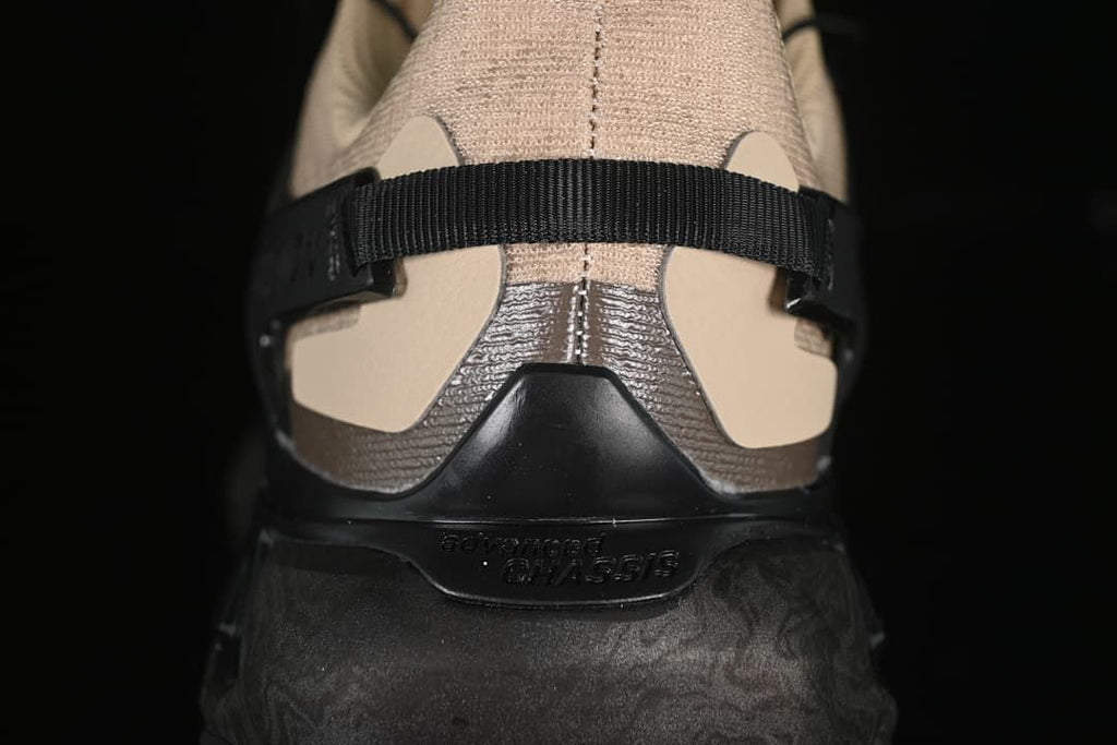 Rear view of the shoe showing the heel strap and sculpted dark sole.