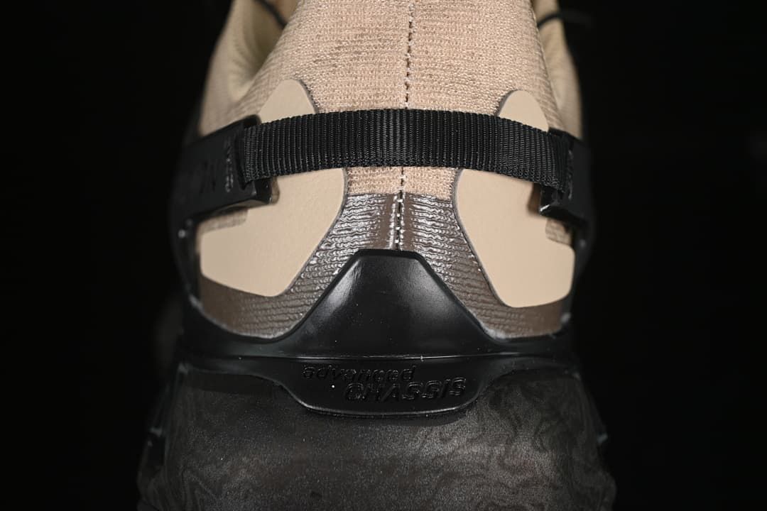 Rear view of the shoe showing the heel strap and sculpted dark sole.
