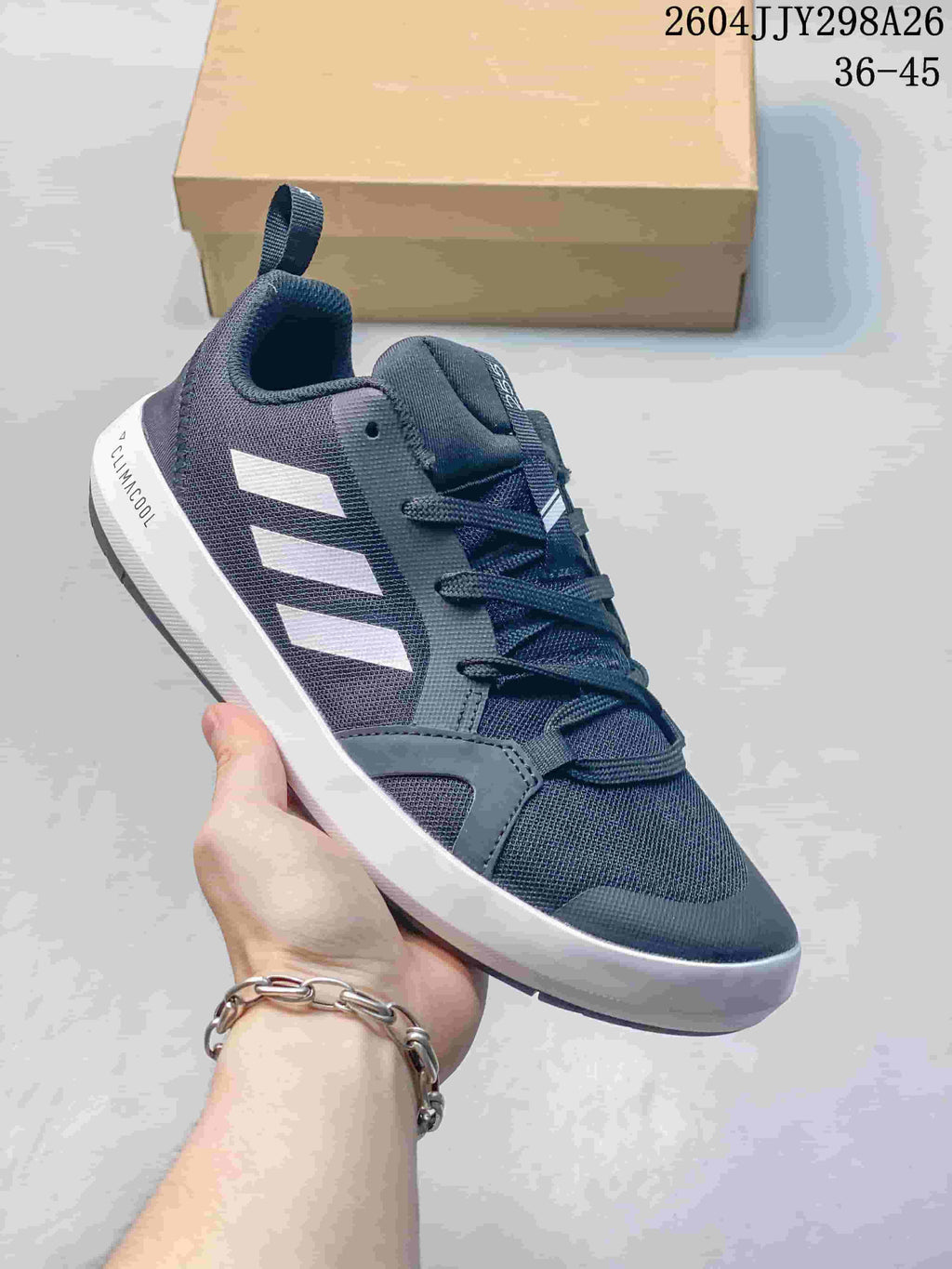 Dark gray Adidas Terrex Boat shoe with white side stripes.