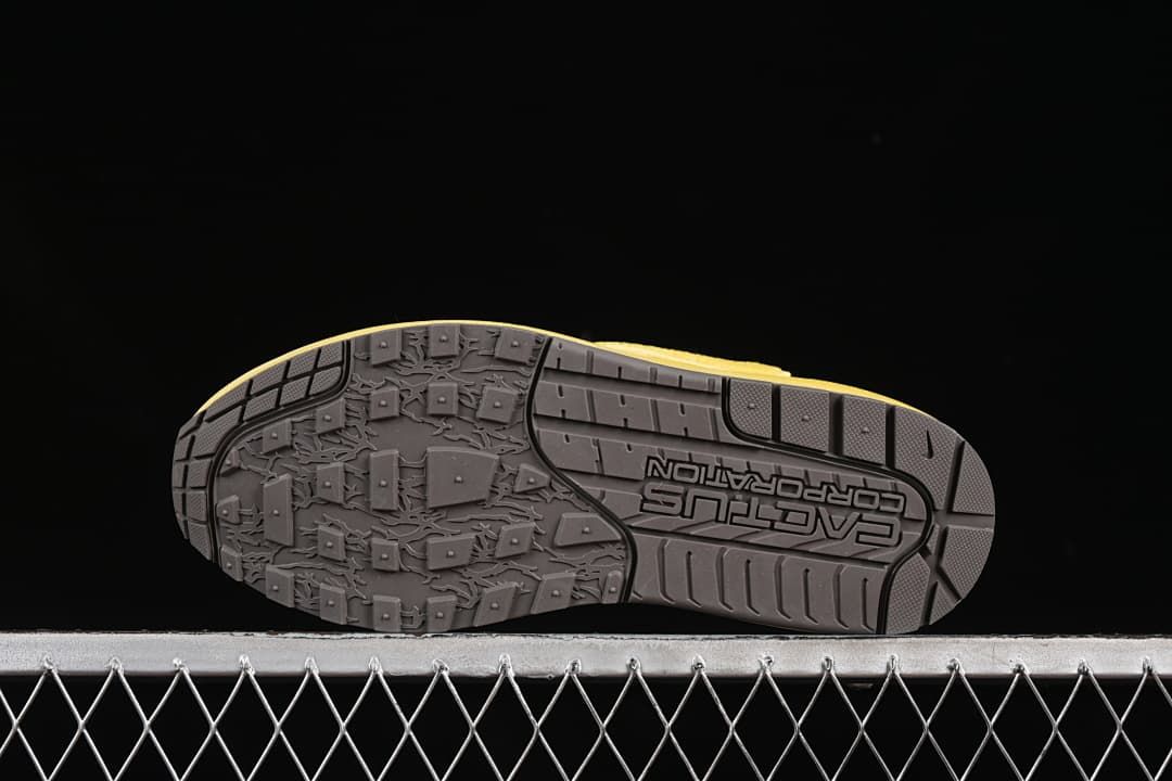 Underside of the sneaker showing the dark tread pattern.