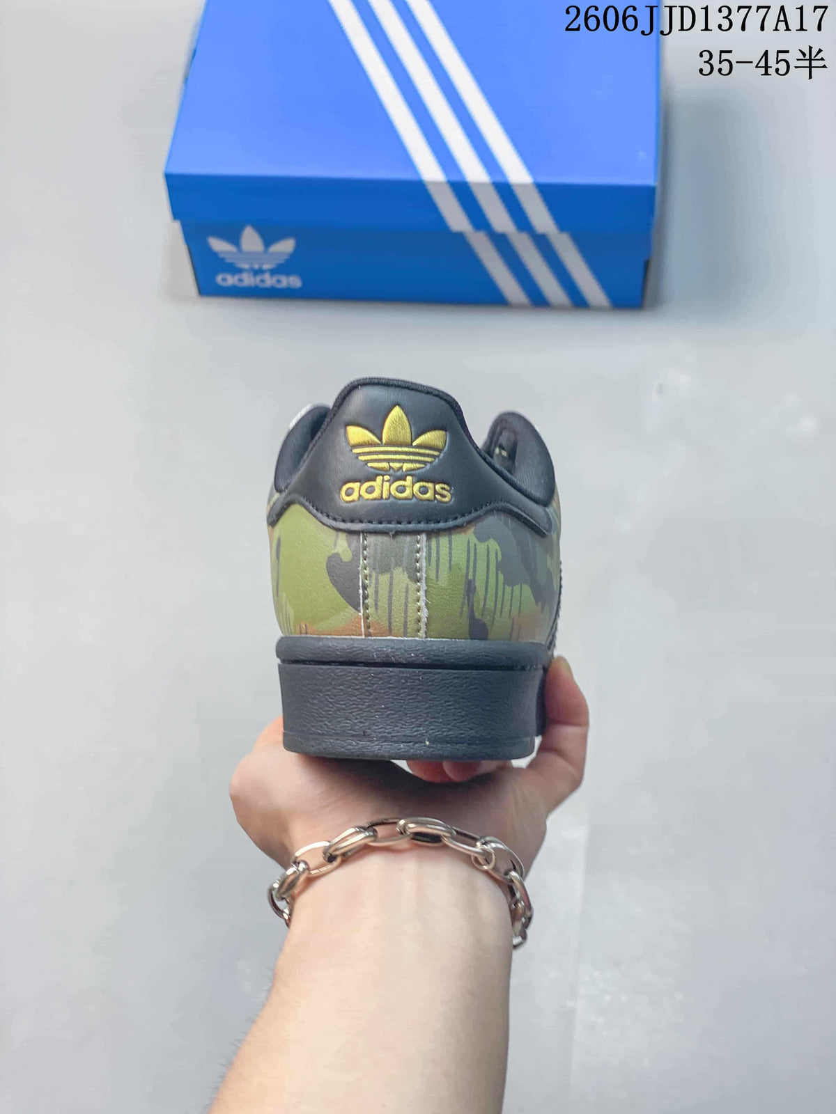 Rear view showing the camouflage heel, dark collar, and gold-colored adidas Trefoil branding