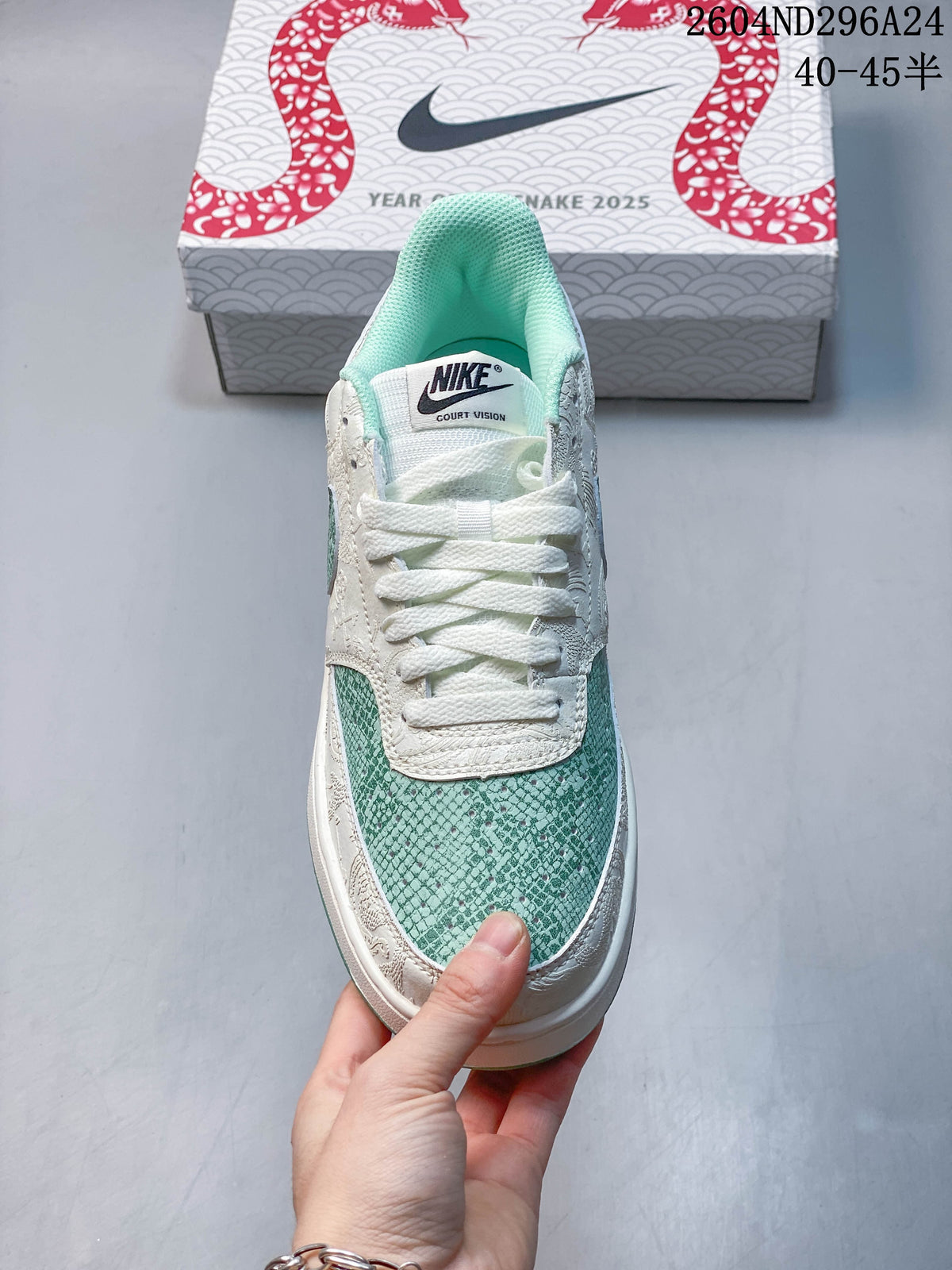 Front view of the low-top sneaker with mint-green patterned toe panel and white laces
