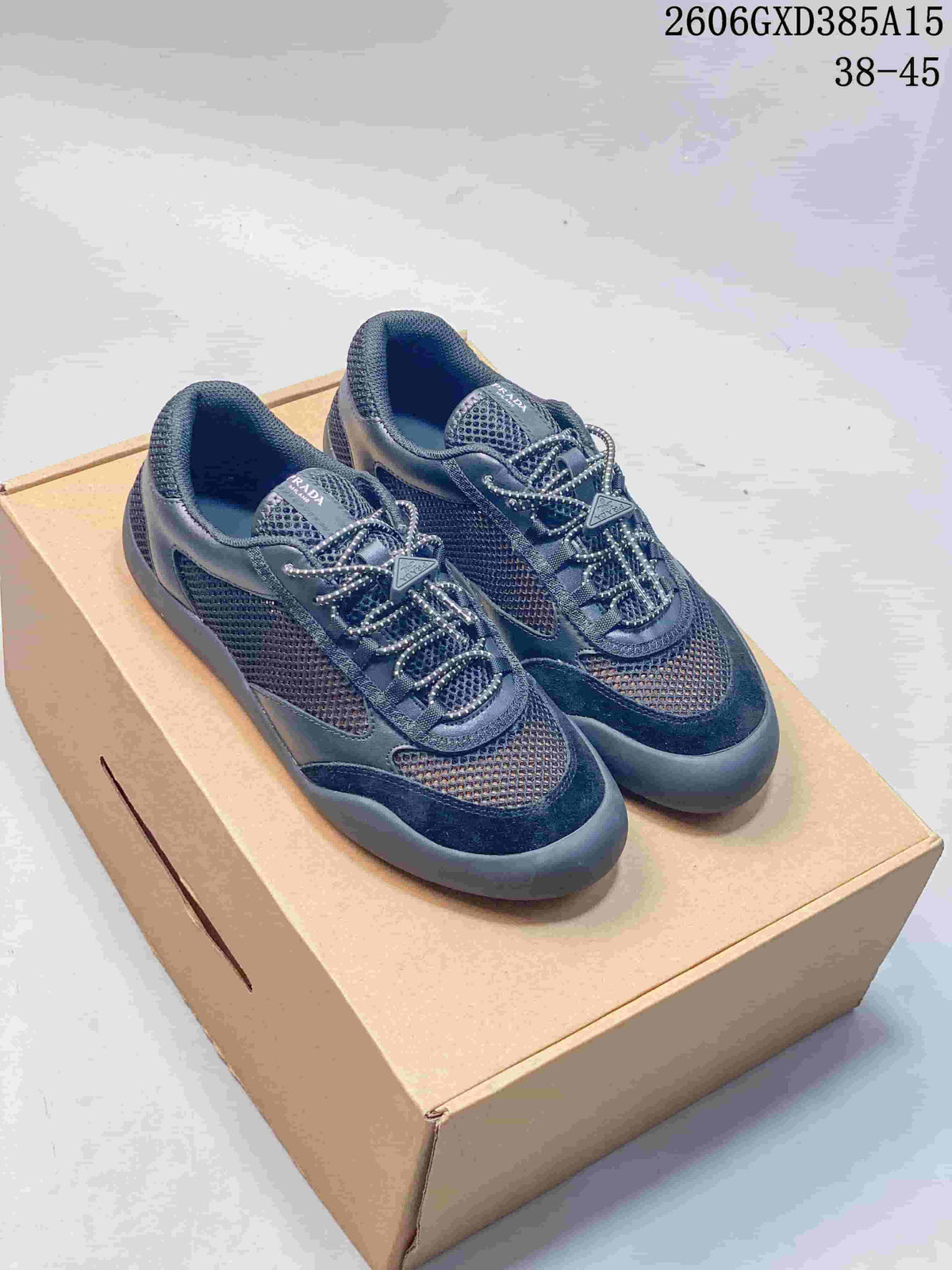 Dark navy mesh-panel low-top sneakers displayed on a box