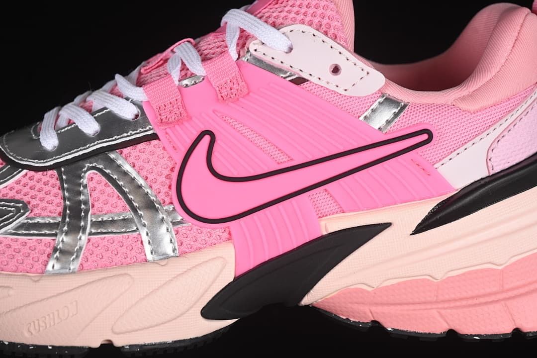 Close-up of the side Swoosh, mesh-look upper, silver-look overlays, and sculpted sole