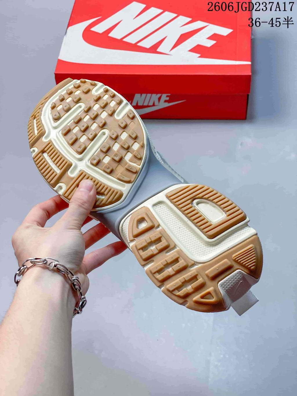 Close-up of the sneakers' tan-patterned outsole.