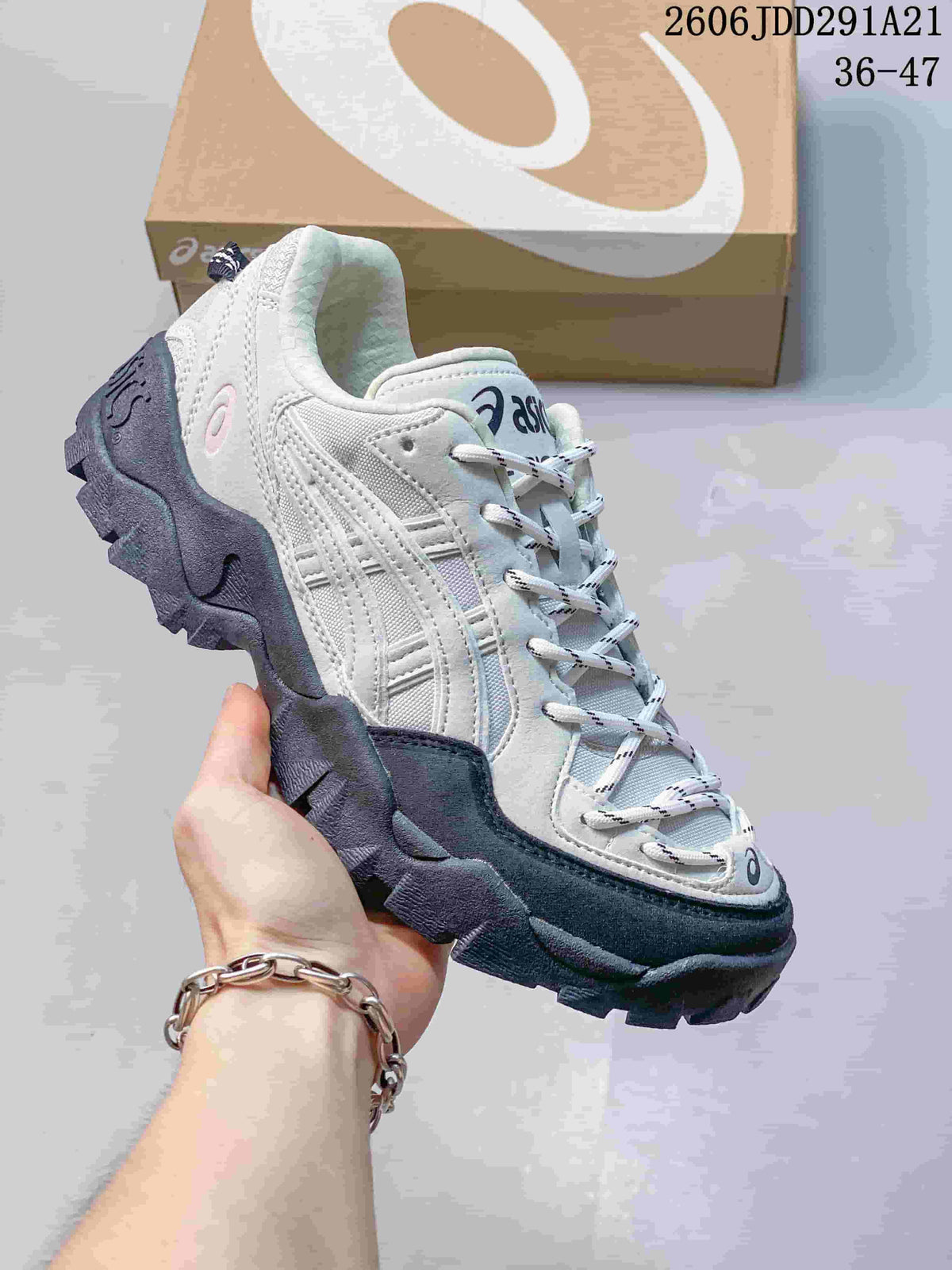 Light gray and white ASICS GEL-PICKAX sneaker shown from the side.
