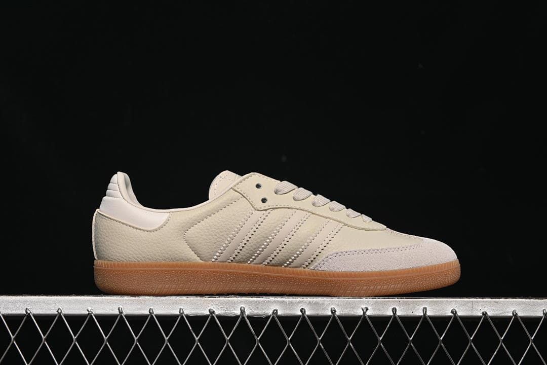 Side profile highlighting the low silhouette, stripes, and gum-look sole.