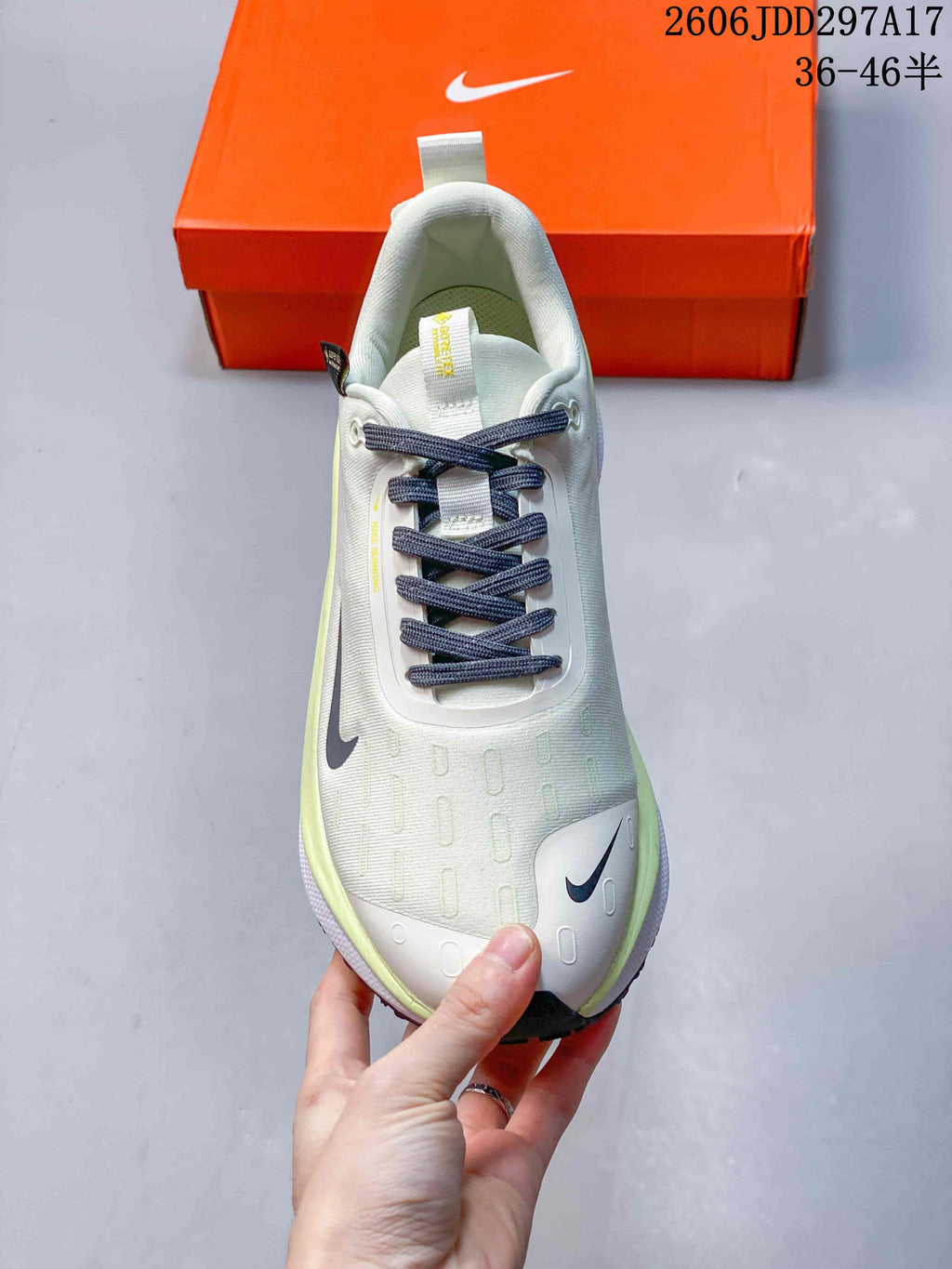 Top view of a Nike InfinityRN 4 shoe with dark laces and lime accents