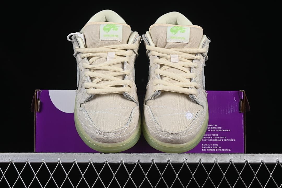 Front view of both shoes displayed against the shoe box