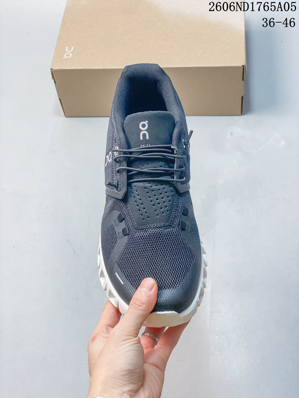 Front view of a charcoal On Cloud 5 sneaker with speed lacing and white sole