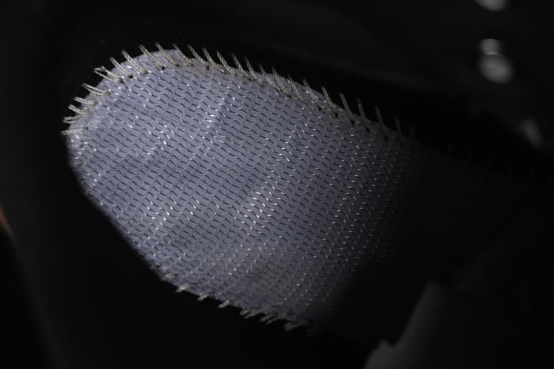 Close-up view of the boot's textured dark fabric.