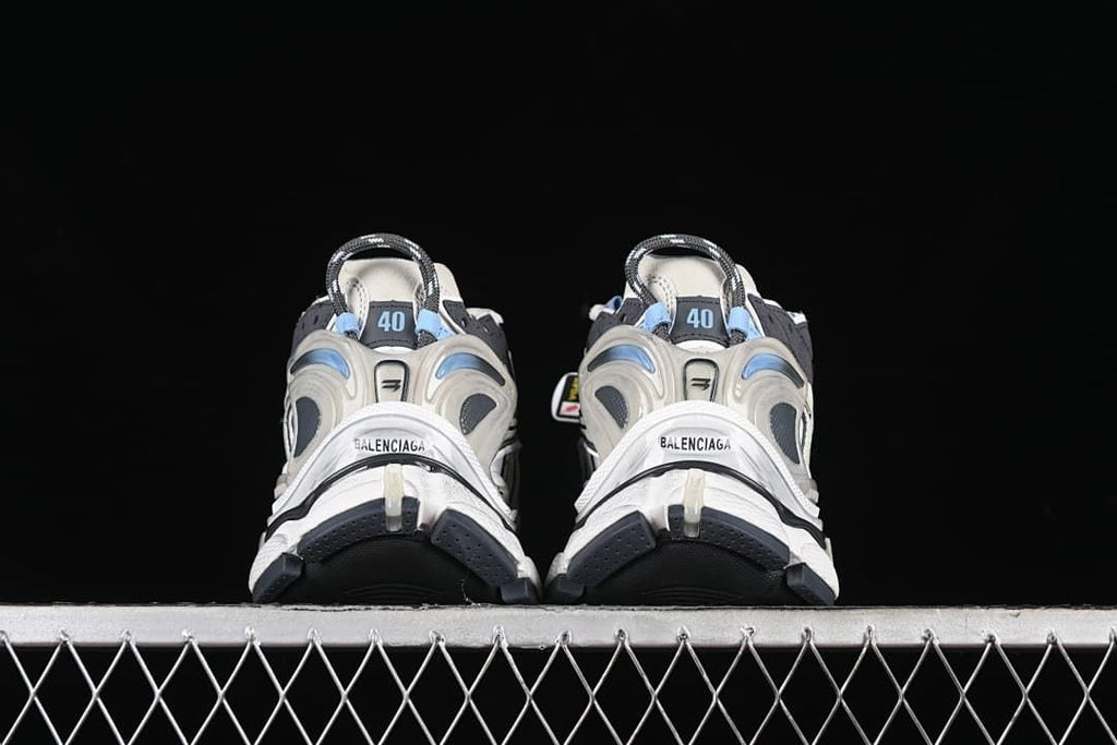 Rear view of the pair showing heel counters and contrasting outsole sections.