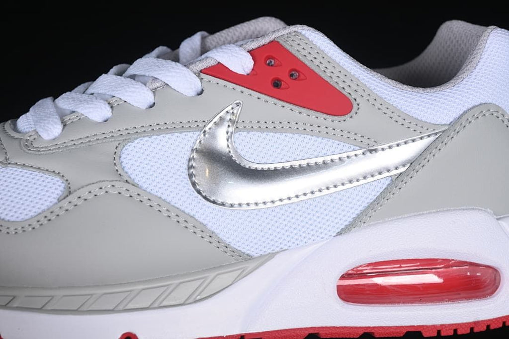 Close-up of the silver side swoosh, grey overlays, and red heel Air unit.