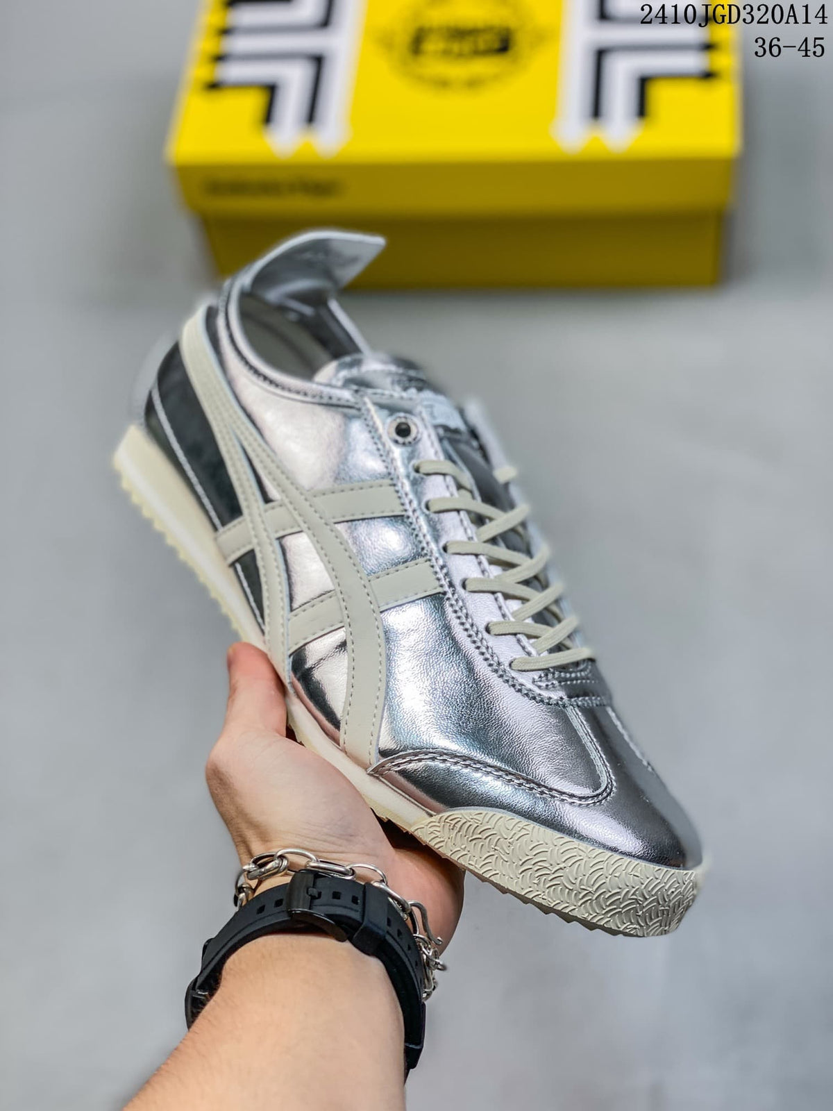 Metallic silver low-top sneaker with pale side stripes