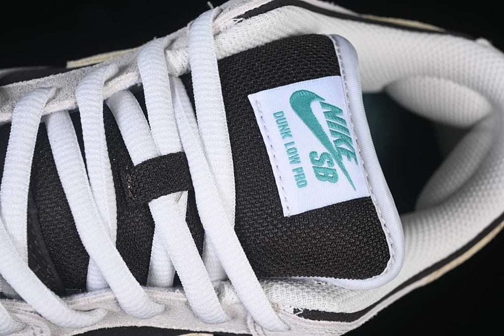 Close-up of the Nike SB Dunk Low Pro tongue label and white laces.