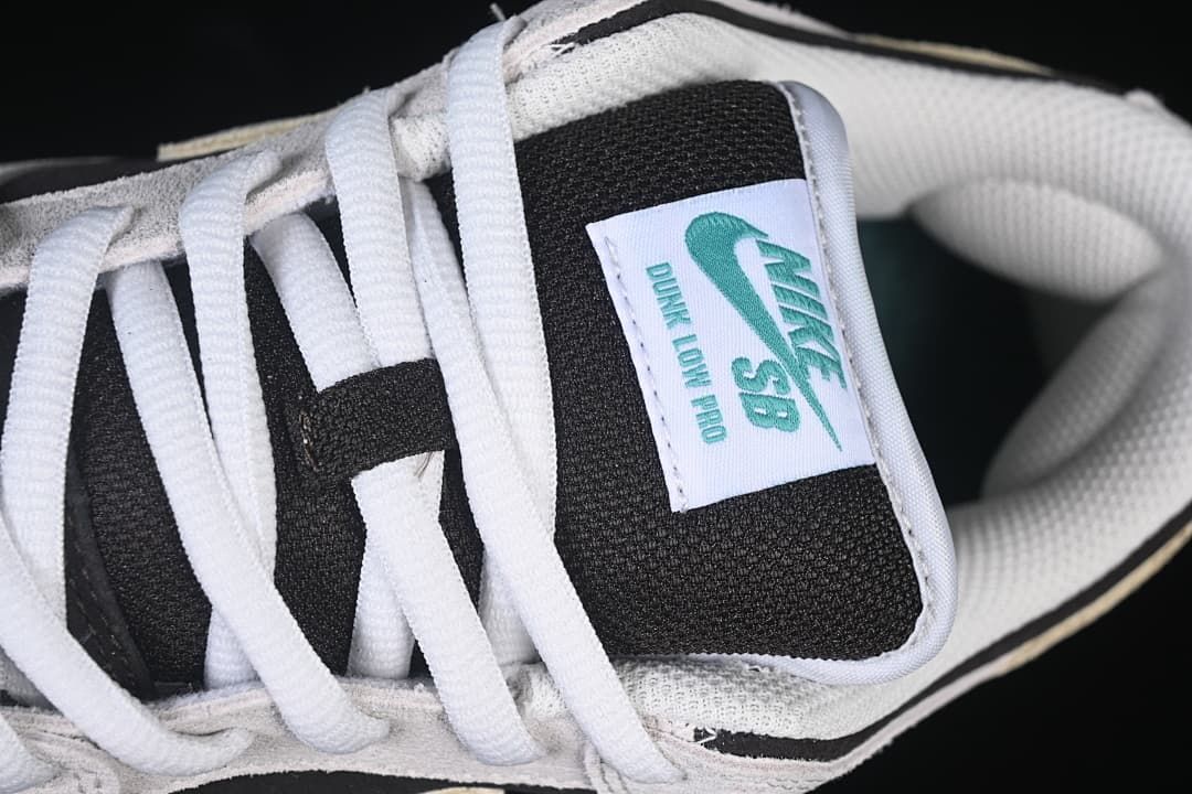 Close-up of the Nike SB Dunk Low Pro tongue label and white laces.