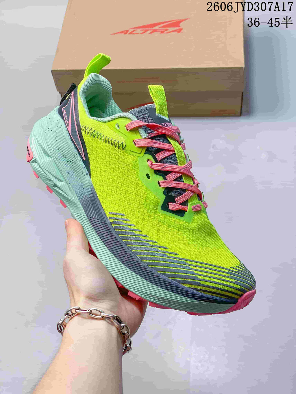 Angled view of the lime green shoe with pink laces and aqua sole; image text lists sizes 36–45.5.