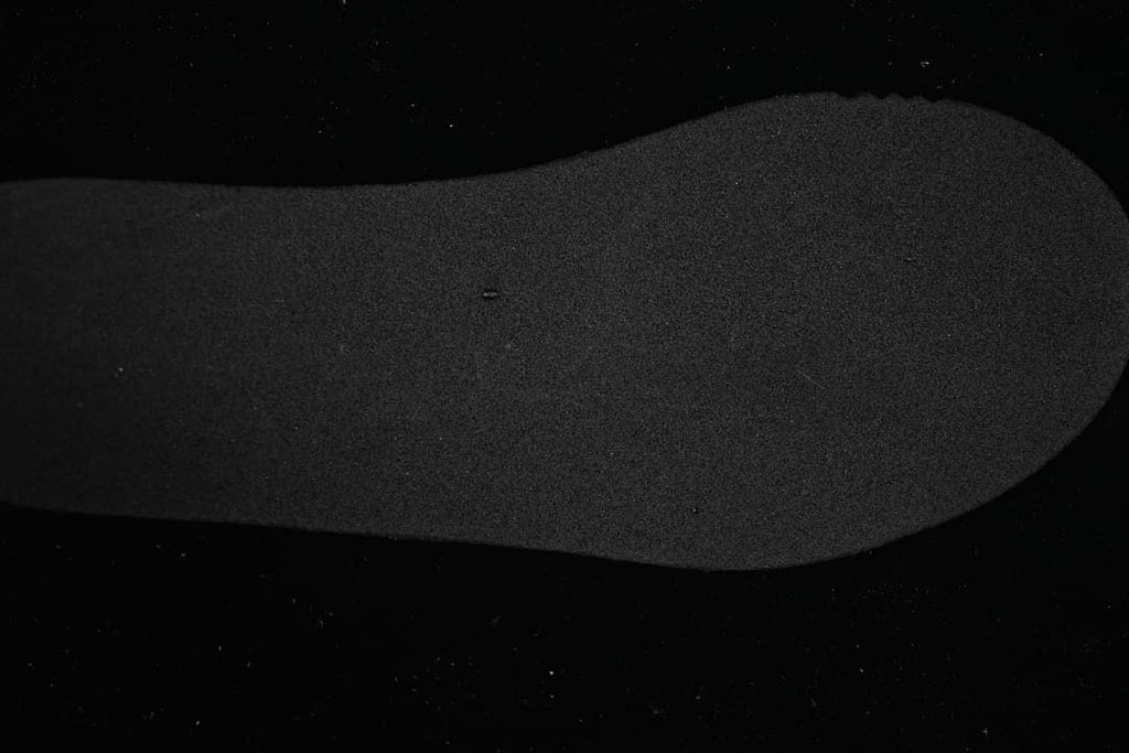 Close-up of the dark insole of the New Balance 327 sneaker.