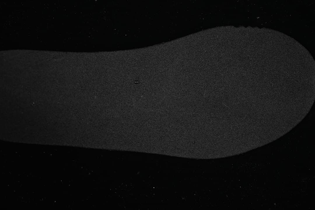 Close-up of the dark insole of the New Balance 327 sneaker.