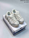 White and grey FILA chunky sneakers displayed on a shoebox